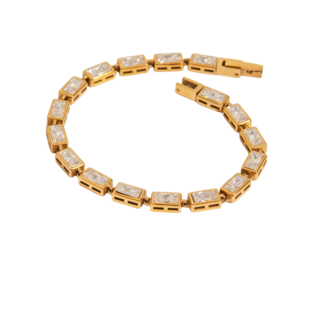 A yellow gold Baguette tennis bracelet featuring rectangular bezel-set diamonds, arranged in a curved circle on a plain white background.