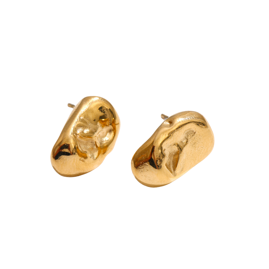 A pair of gold, abstract molten organic stud earrings on a plain white background.